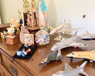 Planes, marbles, trophies, Mother Mary.
