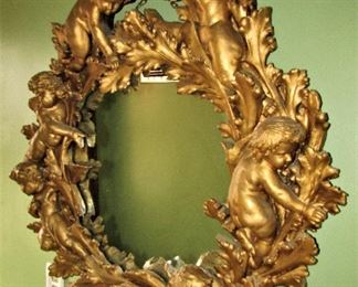 Antique plaster cherub mirror
