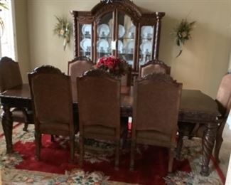 Dining room table with 6 chairs and 2 arm chair