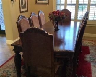 Dining room table with 6 chairs and 2 arm chair