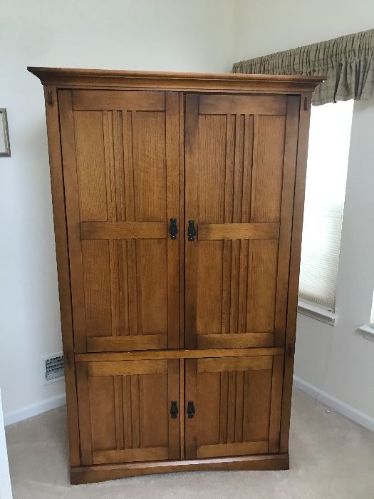 Solid wood and well crafted entertainment armoire!