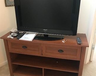 Nice 2 drawer tv stand! Their is also a matching pair of tower curio cabinets!
