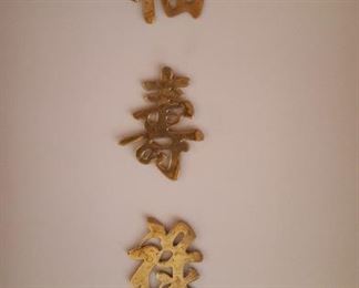 Brass Japanese peace symbols