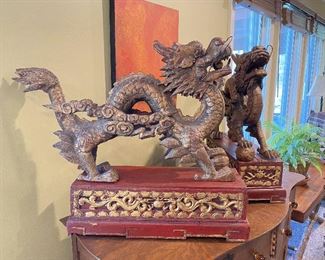 ITEM 1: Magnificent pair of Chinese carved gilt wood dragons on red carved gilt wood bases. base: 7” x 23.325” 7.7625”; dragon: 19.5” x 30” long, 7” wide  $650