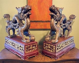 ITEM 1: Magnificent pair of Chinese carved gilt wood dragons on red carved gilt wood bases. base: 7” x 23.325” 7.7625”; dragon: 19.5” x 30” long, 7” wide  $650