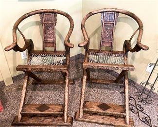 ITEM 2: Two antique Chinese brass-mounted folding magistrate chairs, being sold individually. $1,650 each