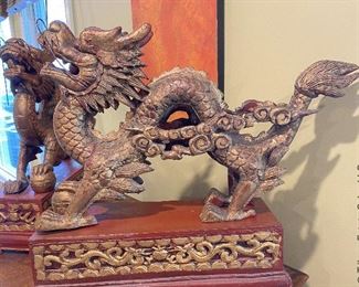 ITEM 1: Magnificent pair of Chinese carved gilt wood dragons on red carved gilt wood bases. base: 7” x 23.325” 7.7625”; dragon: 19.5” x 30” long, 7” wide  $650