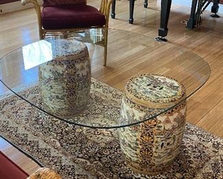 ITEM 11: Pair of garden stools with custom cut tempered glass table top. Glass is 42” x 42” with very rounded corners, and a chip. $325