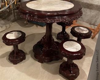 ITEM 10: Carved wood marble inset table with four matching marble inset stools. This piece has some condition issues, and needs some clamps and glue to return it to full beauty. $495
