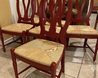 ITEM 18: Set of six red chairs with rush seats. Very good condition $500