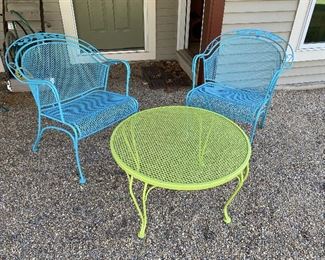 ITEM 24: Green metal side table with two metal chairs painted in shades of blue. Excellent condition. $195