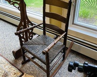 ITEM 31: Child’s ladder back rocker with rush seat $45