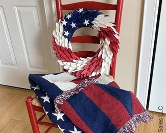 ITEM 57: Red Ladder Back Rush seat chair (slight wear), Woven American Flag Throw 70"X 49”, Wood Curl Patriotic Wreath $65