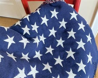 ITEM 57: Red Ladder Back Rush seat chair (slight wear), Woven American Flag Throw 70"X 49”, Wood Curl Patriotic Wreath $65