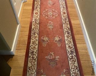 ITEM 73: Wool rug, rose and beige. 120” x 30” $495