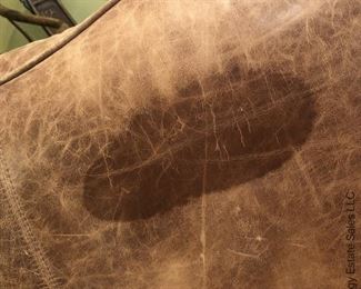 ITEM 96: Brown distressed leather chair 44"(W)X 3'3" (H) X 3' 1" (D) X 19" seat Height $385