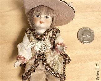 ITEM 106: two small porcelain dolls $20