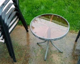 28. small glass top patio table $10