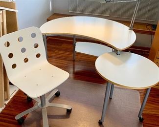 Compact 46w x 29.5w x 28.5h White Bean shape 2 tier Desk  w/ storage shelf under bean. 24” Round rolls under bean; attached light Included $100
5 caster White Chair $39
