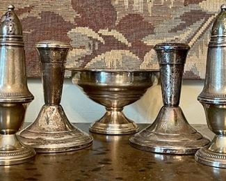 Item 237:  Lot of Sterling Silver:   $165                                                                                   Salt & pepper shakers                                                                                  Candlesticks - 4"                                                                                               Candy Dish - 5" x 3"