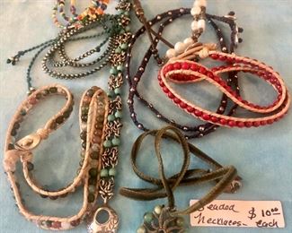 Assorted necklaces, bracelets, pins, and earrings at the sale!  Make an appointment today!