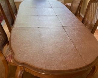 Vintage dining table and chairs in perfect condition (shown here with table pads)