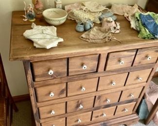 Antique dresser, antique baby clothes 