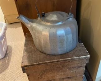 Antique kettle and wood crate 