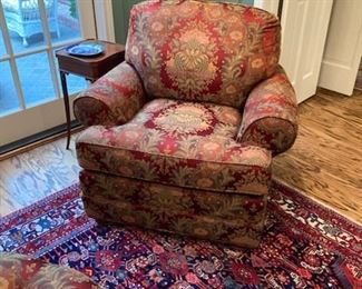 comfortable upholstered chair with neat round ottoman
