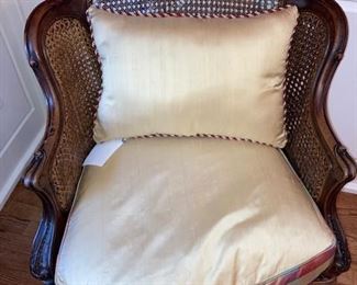 one of a pair of oak and cane chairs