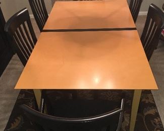 Beautiful dining set shown in photos with and without leaves and black center strip. Purchased from Bova Furniture.