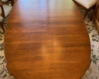 Oval cherry scalloped apron table with 2 leaves