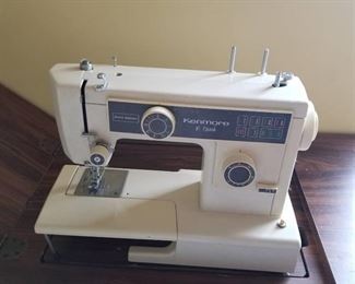 Kenmore 10 stitch sewing machine with cabinet, chair and supplies