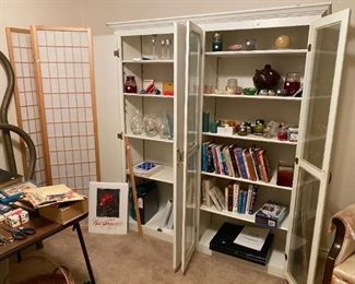 unique storage cabinet. lots of candles and vases Light weight room divider