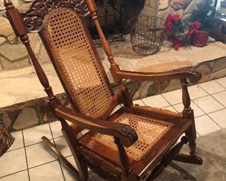 Beautifully carved rocker with cane back and seat.  Brought from the Dominican Republic