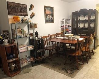 Drop leaf dining table, chairs, china cabinet, cook books.