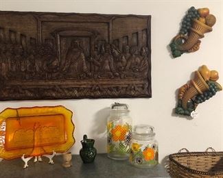 Hand carved wooden relief of The Last Supper.
Tiara Indiana glass Amberina Last Supper tray 
McCoy Glass flower jars 