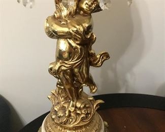 Brass cherub holding lamp with marble base and prisons. Great find. 