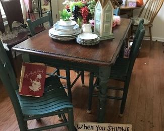 Four ft wood farmhouse table and four ladder back chairs. Great for small areas. 