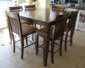 #27.  Additional view.   Bistro height with 6 bar stools includes one leaf,  $200.00                                                                         Table 36” X 54” X 54” includes 18” leaf/                      chairs   40” X 18” X 20