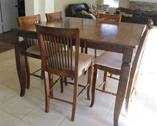 #27 Extra view..#27.  $200.00   High table with 6 bar stools includes one leaf Table 36” X 54” X 54” includes 18” leaf/ chairs            40” X 18” X 20 