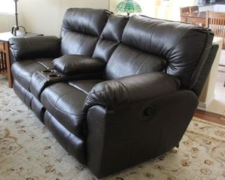 #29.  $300.00   Chocolate brown leather reclining sofa w/ cup holders 40” X 83” X 38” 