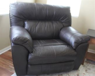 #33.  $200.00   Chocolate brown oversize leather recliner chair 40” X 46” X 40” 