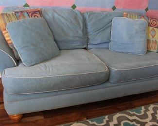#42.  $125.00   Blue sofa wear to fabric/ fading 36” X 91” X 38” 