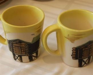 #64.  $20.00   Pair Sascha B coffee mugs 