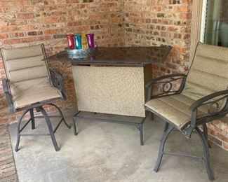 Outdoor bar and two stools