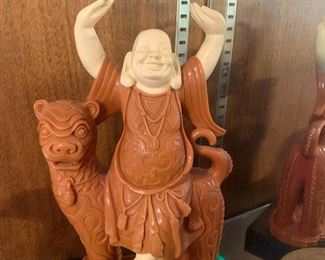 Humorous monk figurine