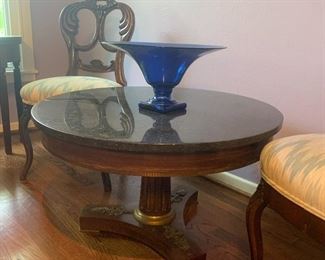 Round side table with pedestal base and stone top