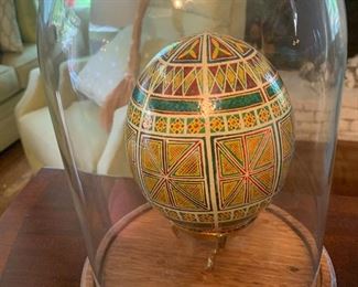Decorative hand-painted egg in display case