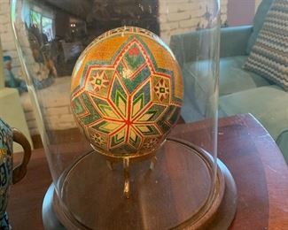 Hand-painted decorative egg in display case